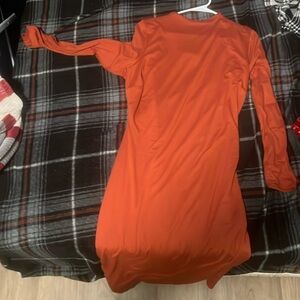 Deep orange Fashion nova fitted dress in an 1X size.